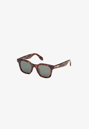 Sonnenbrille aus Schildpatt mit dunkelgrauen Gläsern. Quadratisches Gestell mit glänzender Oberfläche. Metalldekor an den Bügeln. Klassisches Design und leicht.
