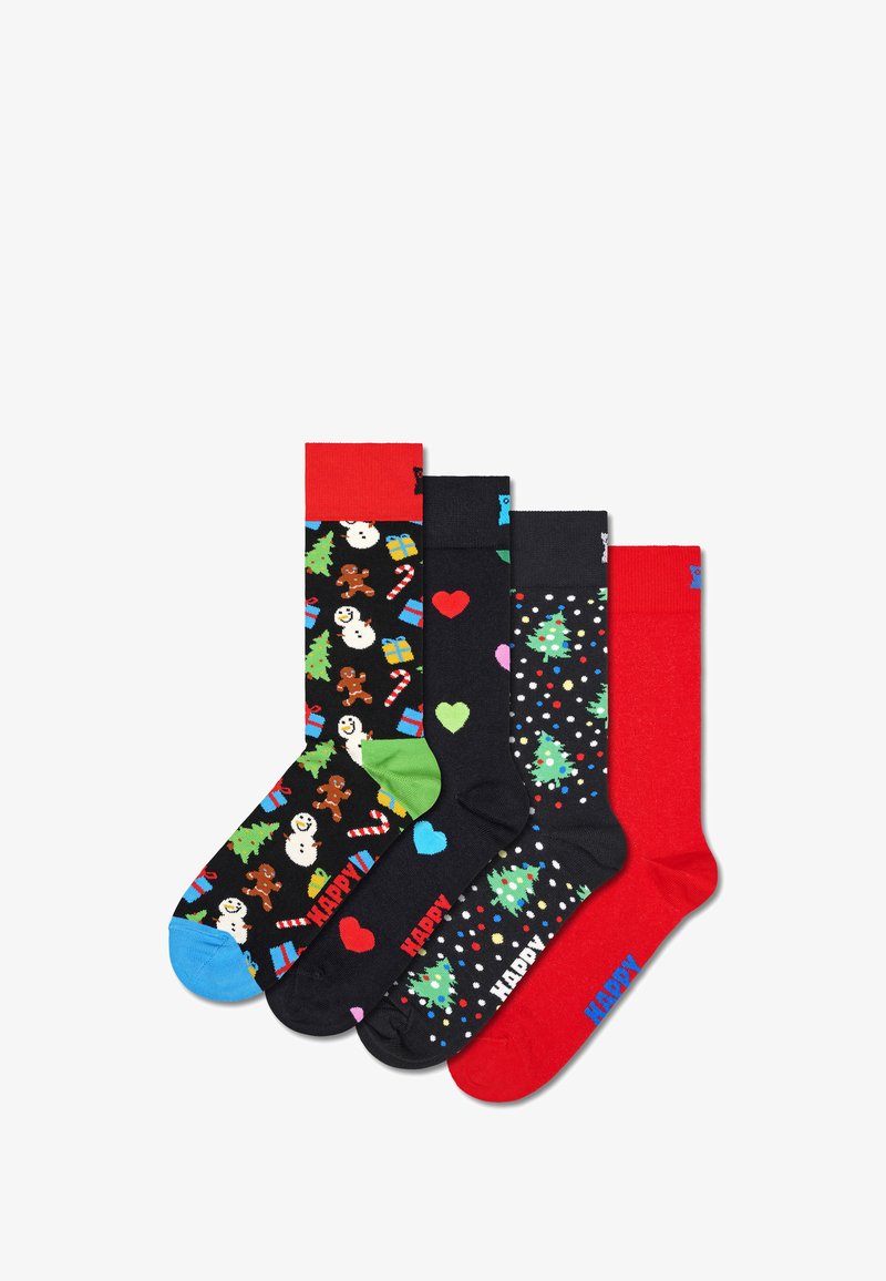 Quatre paires de chaussettes en coton : designs festifs avec des bonshommes de neige, des sapins et des cœurs ; les couleurs incluent du noir, du rouge, du vert et des accents bleus.