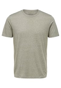 Grå melerad crew neck t-shirt gjord av mjukt material, kortärmad och med lös passform. Har en enkel design med minimal detaljering.