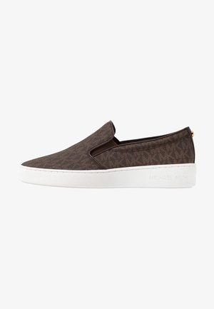 Brown slip-on shoes with a textured pattern, featuring a white sole and subtle branding on the side. Elastic side inserts for easy wear.