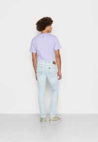 Lee LUKE - Calças de ganga justas - light-blue denim