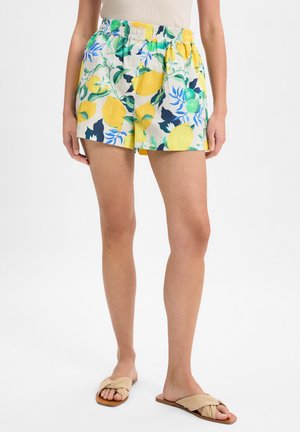 Weiße Baumwollshorts mit einem Zitronen- und Blättermuster in Gelb, Grün und Blau. Sie verfügen über einen elastischen Bund und eine lockere Passform.