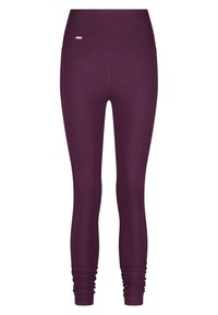 Leggings violets avec une taille haute, fabriqués en tissu extensible. Dotés de poignets froncés aux chevilles et d'un détail logo doré sur la taille.