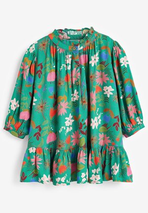 Grøn blomsterkjole med lange pufærmer, en flæset kant og knaplukninger foran. Har farverige mønstre af blomster og blade.