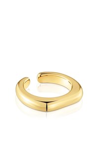 Złota metalowa otwarta bransoletka z gładkim, zaokrąglonym wzornictwem i polerowaną powierzchnią, charakteryzująca się eleganckim, minimalistycznym kształtem.