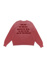 Red cotton sweatshirt with crew neck, long sleeves, and ribbed cuffs. Back features bold text: "ON THE DEVIL LET'S STOMP" in dark red.