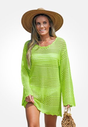 Knit cover-up in bright neon green, featuring loose fit, wide long sleeves, and open weave design. Includes a textured, woven bag.