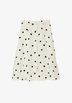 Hvid A-formet nederdel med sorte uregelmæssige polkaprikker og lukning med knapper foran.