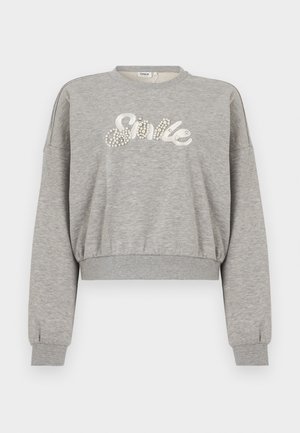 Gray cropped sweatshirt with long sleeves, features white "Smile" text embellished with pearl-like details. Made of soft, textured fabric.