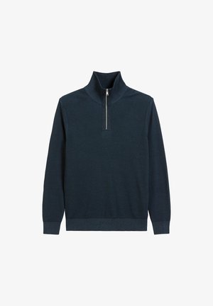 Pull-over à col zippé bleu marine en tissu tricoté texturé. Doté d'un col haut et de poignets et d'un ourlet côtelés.