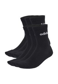 Calcetines de algodón negros en un paquete de cuatro, con textura acanalada, de longitud media y con un logotipo blanco impreso en el lado exterior.