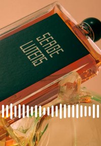 Amber glass perfume bottle with a black label featuring white text. Rounded black cap and geometric design on the label. Clear accent base.