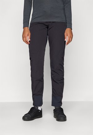 Black lightweight pants with a slim fit, elastic waistband, and contrasting cuffs. Worn with black sneakers, showcased against a white background.