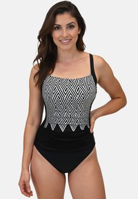 Maillot de bain noir avec un motif géométrique blanc sur le buste, présentant des bretelles réglables, un décolleté carré et une culotte taille haute.