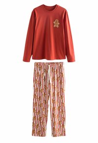 Red long-sleeve pajama top with a gingerbread man applique, paired with white pants featuring a gingerbread pattern on red stripes.