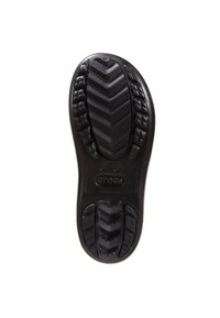 Semelle de chaussure en caoutchouc noir avec un motif de semelle présentant des rainures en zigzag et des formes de diamant. Logo imprimé sur la semelle intermédiaire. Texture lisse.