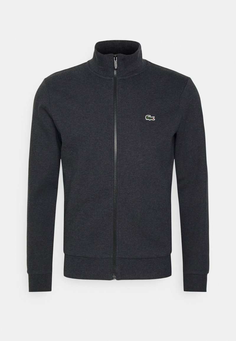 Sweat-shirt zippé homme gris foncé avec col montant et petit logo crocodile vert sur le côté gauche de la poitrine.