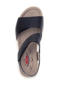 Sort læder sandal med krydsede stropper, polstret sål og lys sål. Interiøret prydes af logo og designelementer.