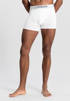 White cotton boxer briefs with a soft elastic waistband, featuring the brand "DSTREZZED" printed in dark letters. Smooth fabric texture.