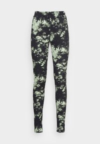 Svart och ljusgrön tie-dye leggings med hög midja och en mjuk, elastisk textur. Åtsittande design som sträcker sig ner till vristerna.