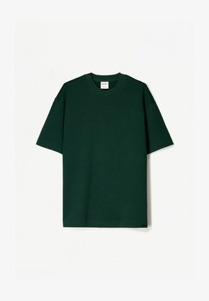 Mörkgrön kortärmad t-shirt i mjukt bomullstyg, med en rundad halsringning och en rak, avslappnad passform.