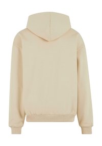 Beige hoodie med en kenguruficka och en dragsko i huvan. Mjuk tyg, ribbade ärmslut och midja. Enkelt, minimalistiskt design.