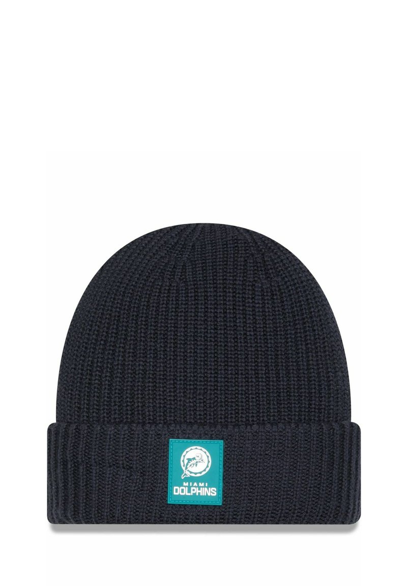 Dark navy knitted beanie with a ribbed fold-over cuff. Features a square logo patch in teal with a dolphin graphic and text “MIAMI DOLPHINS.”