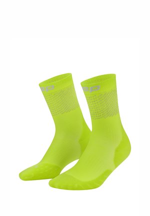 Pair of bright yellow-green athletic socks with ribbed cuffs and subtle gray patterns near the top on a white background.