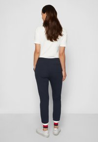 Tommy Hilfiger HERITAGE PANTS - Pantalones deportivos - midnight