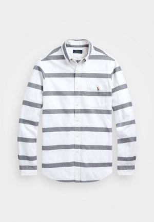 Witte blouse met knopen, grijze horizontale strepen, lange mouwen, borstzak en Polo Ralph Lauren-logo geborduurd op de zak.
