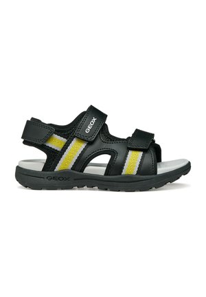 Sandalo Geox nero e giallo con cinturini regolabili in Velcro e suola imbottita progettata per comfort e aderenza.