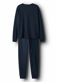 Haut à manches longues bleu marine foncé avec un pantalon de jogging assorti, les deux présentant des manches et des chevilles resserrées, exposés à plat sur un fond blanc.