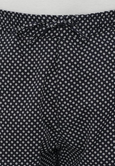 Tissu noir avec des pois circulaires blancs, doté d'une taille élastique avec un détail de nœud. Texture douce et design décontracté.