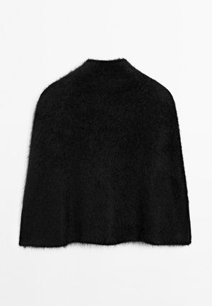 Cappotto di pelliccia nera con colletto alto e superficie morbida e testurizzata. Il design presenta una silhouette ampia e fluida, senza chiusure visibili.