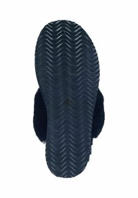 Black fuzzy slipper sole with wavy texture. Material appears rubberized, providing grip. Rounded shape with soft upper edge.