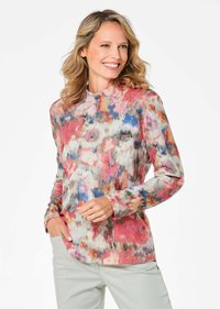 Langärmlige Bluse mit einem bunten abstrakten Druck in Rosa, Blau und Grautönen. Hergestellt aus weichem Stoff mit einem runden Ausschnitt und lockerer Passform.