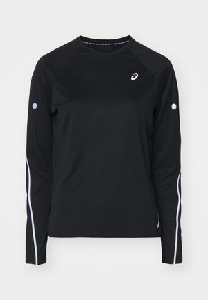 Black long-sleeve athletic shirt with raglan sleeves, white reflective stripes along the sides, and a round neck. Features a small logo on the chest.