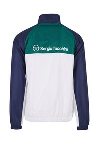 Giacca a track con torso bianco, maniche blu navy e colletto verde. Presenta polsini elastici e orlo inferiore con logo 'Sergio Tacchini'.