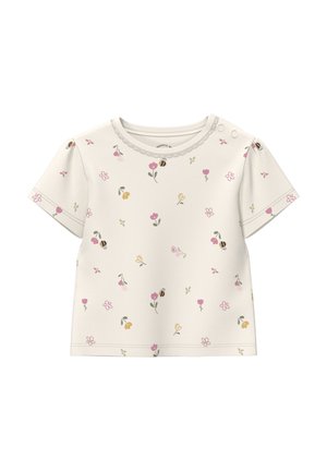 Kremowa koszulka niemowlęca z krótkim rękawem, ozdobiona małymi różowymi, żółtymi i zielonymi wzorami kwiatów i pszczół, z zatrzaskami na jednym ramieniu.