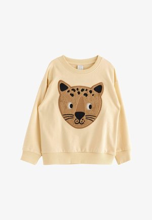 Beige, lange mouw, kinderpullover met een grote, getextureerde luipaardgezichtsapplicatie met zwarte vlekken en ogen aan de voorkant.