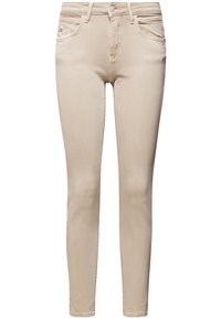 Beige skinny jeans made from stretch denim. Feature a mid-rise waist, five pockets, and subtle stitching details on the front.