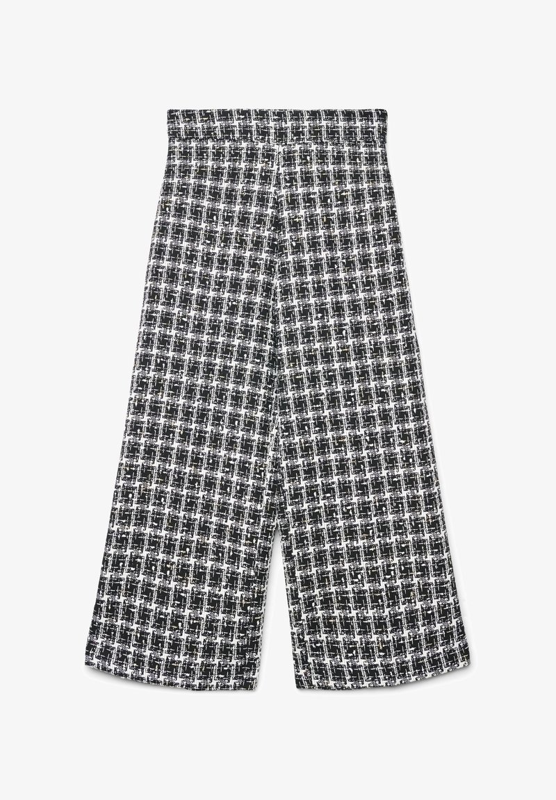 Pantalon à jambes larges à motif à carreaux noir et blanc, avec un tissu texturé et une taille haute. Coupe ajustée sans fermetures visibles.