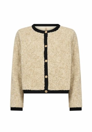 Beige cardigan i falsk pels med sort kant, rund hals og seks guldknapper foran; afslappet pasform og tekstureret overflade.