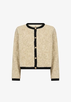Cardigan en fausse fourrure beige avec bordure noire, col rond et six boutons dorés sur le devant ; coupe décontractée et surface texturée.
