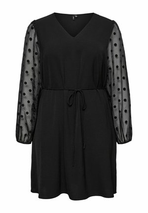 Melnas kleitas ar V-veida kakla izgriezumu un elastīgu jostasvietu. Caurspīdīgas, rozā punktiņu garas piedurknes; mīksts audums; virs ceļgaliem.