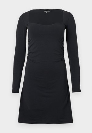 Vestito nero a maniche lunghe con scollo quadrato, corpino aderente, lati plissettati e orlo svasato. Realizzato con un tessuto morbido ed elastico.