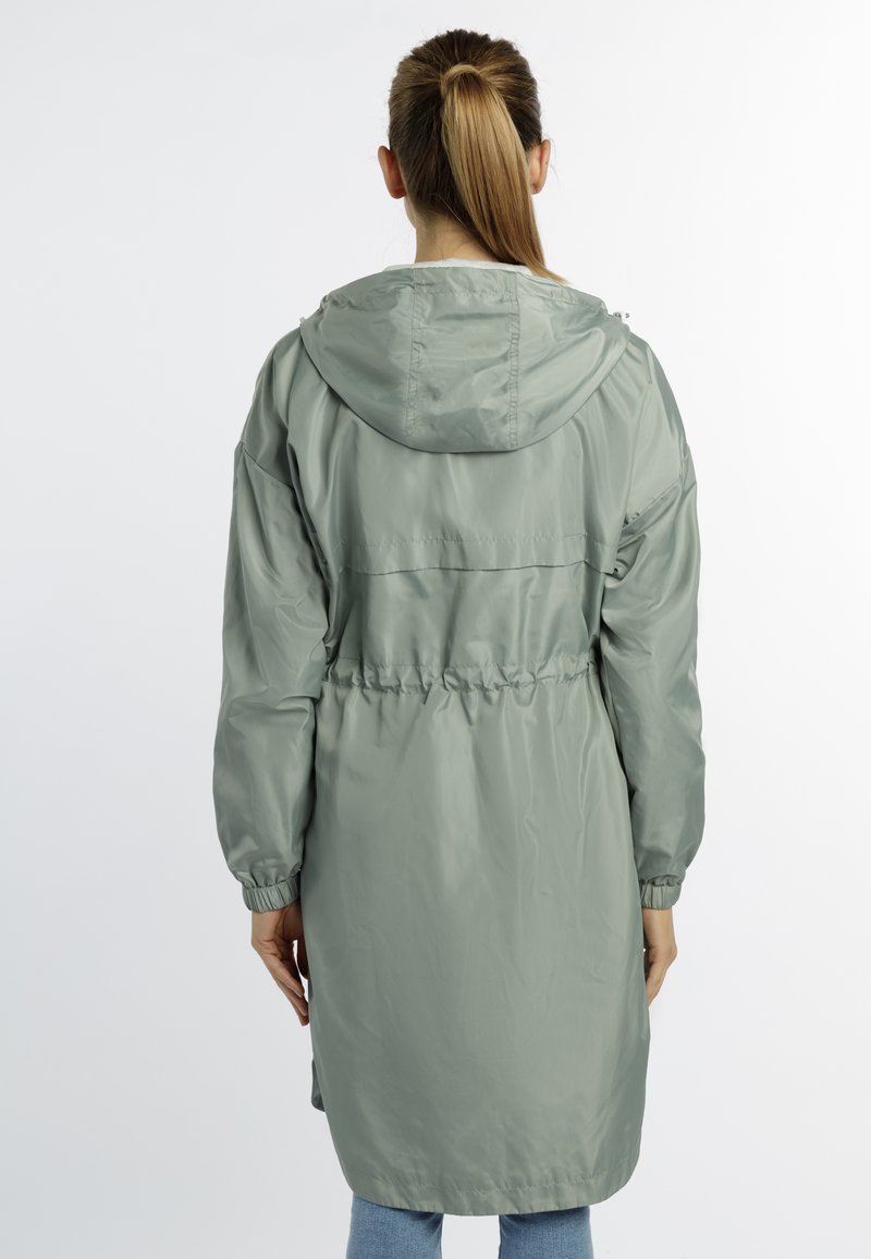 Hellgrüne, kapuzenähnliche Regenjacke mit elastischen Bündchen und verstellbarem Bund. Glattes, wasserabweisendes Material, mittellang mit einer lässigen Passform.