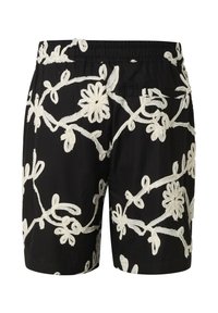 Shorts noirs avec broderie florale blanche, taille élastique et une poche arrière, vus de dos.
