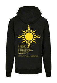 Crna dukserica s kapuljačom koja na leđima ima živopisnu žutu grafiku suncokreta, uz popis naziva pjesama u žutom tekstu.