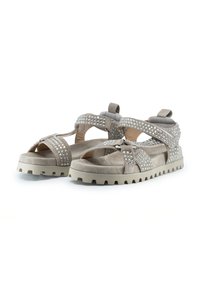 Sandalias de ante beige con acentos de strass, diseño abierto, correas ajustables y suelas de goma gruesas y texturizadas para un buen agarre y comodidad.
